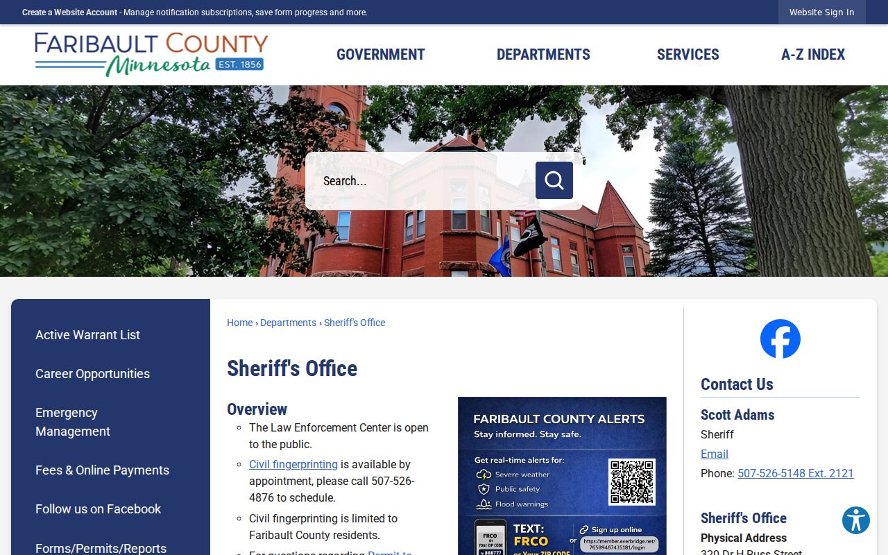Faribault County Sheriff's Office page showing the Law Enforcement Center contact block and warrant resources
